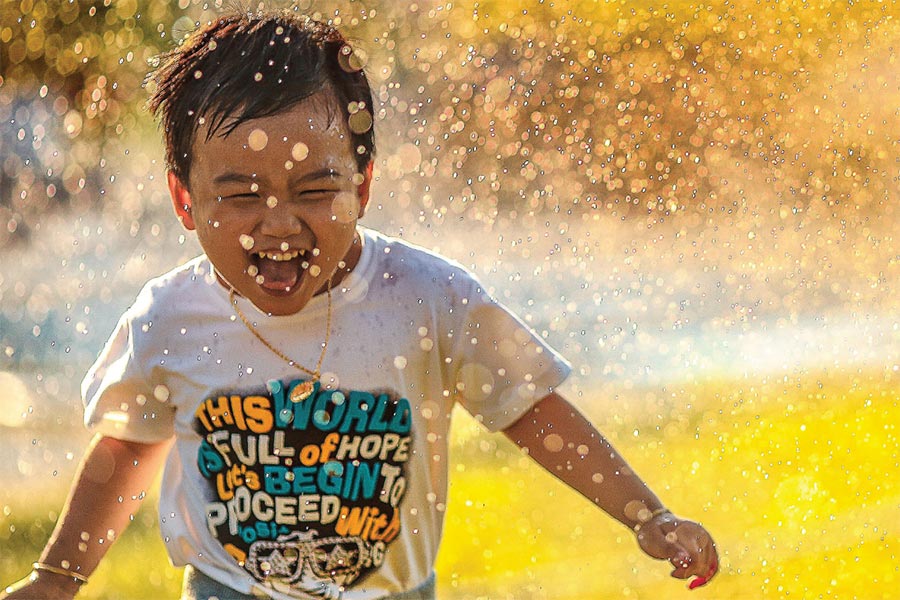 Boy plays in water