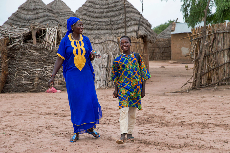 Mother and child walking. Photo by Images of Empowerment. All rights reserved.